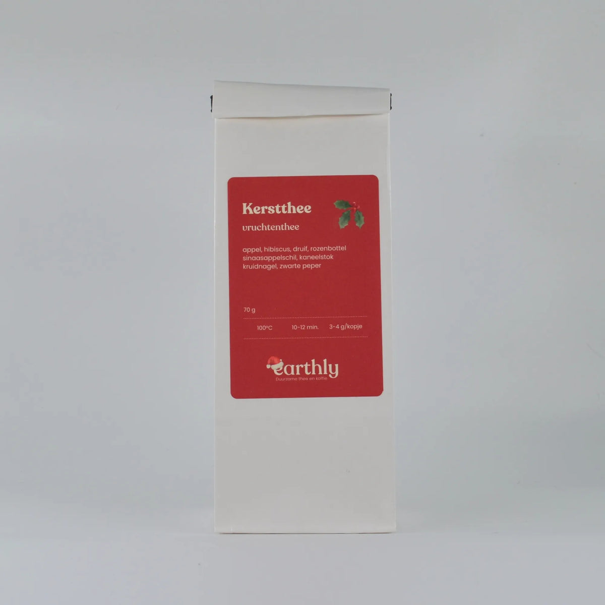 Witte verpakking kerstthee vruchtenthee van Earthly met ingrediënten en zetinstructies