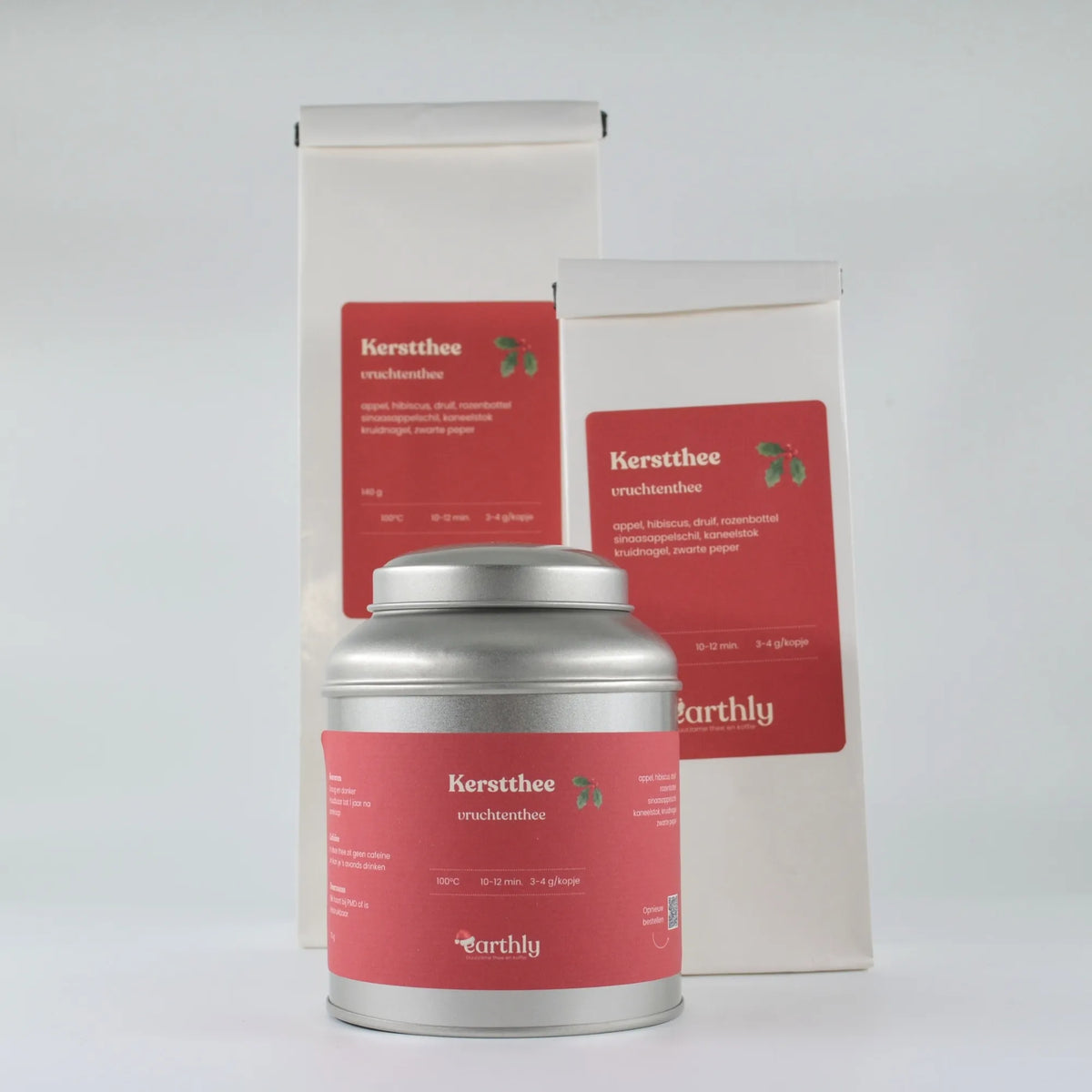 Verpakkingen kerstthee vruchten thee met appel, hibiscus en kaneel van Earthly