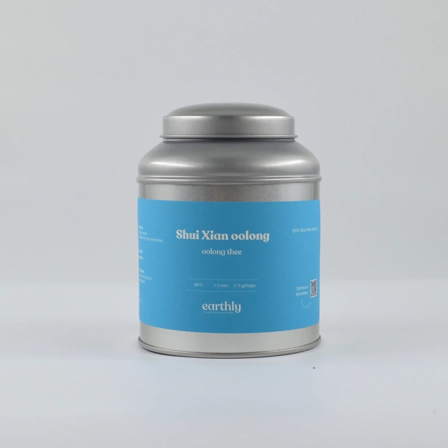 Metalen theeblik met blauwe etiket Shui Xian oolong thee van Earthly