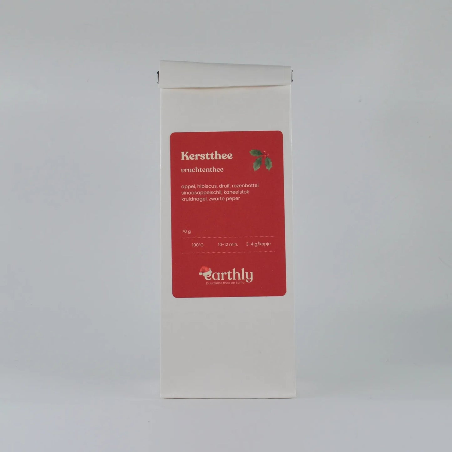 Witte verpakking kerstthee vruchtenthee van Earthly met ingrediënten en zetinstructies
