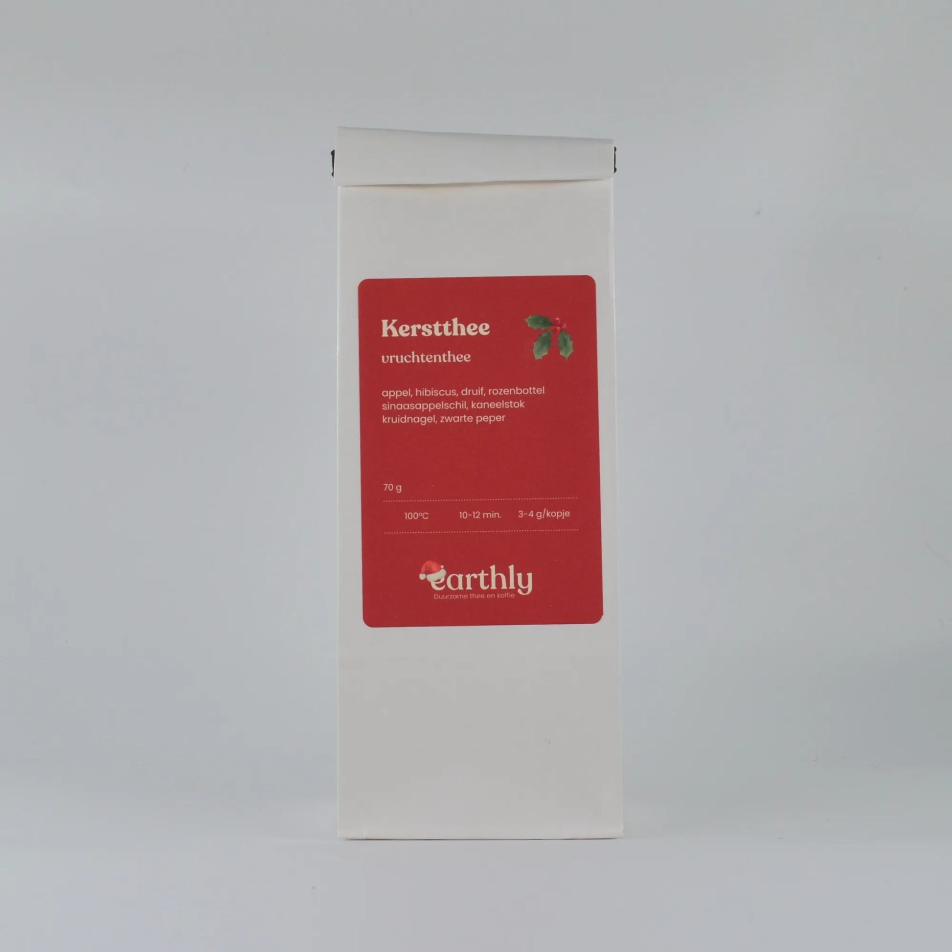 Witte verpakking kerstthee vruchtenthee van Earthly met ingrediënten en zetinstructies