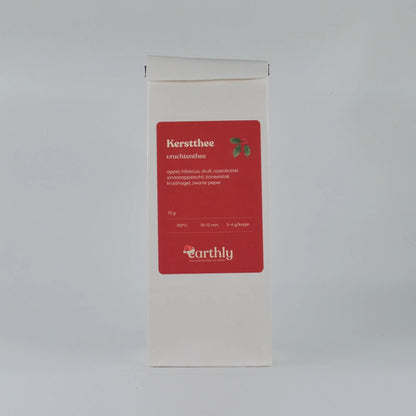 Witte verpakking kerstthee vruchtenthee van Earthly met ingrediënten en zetinstructies