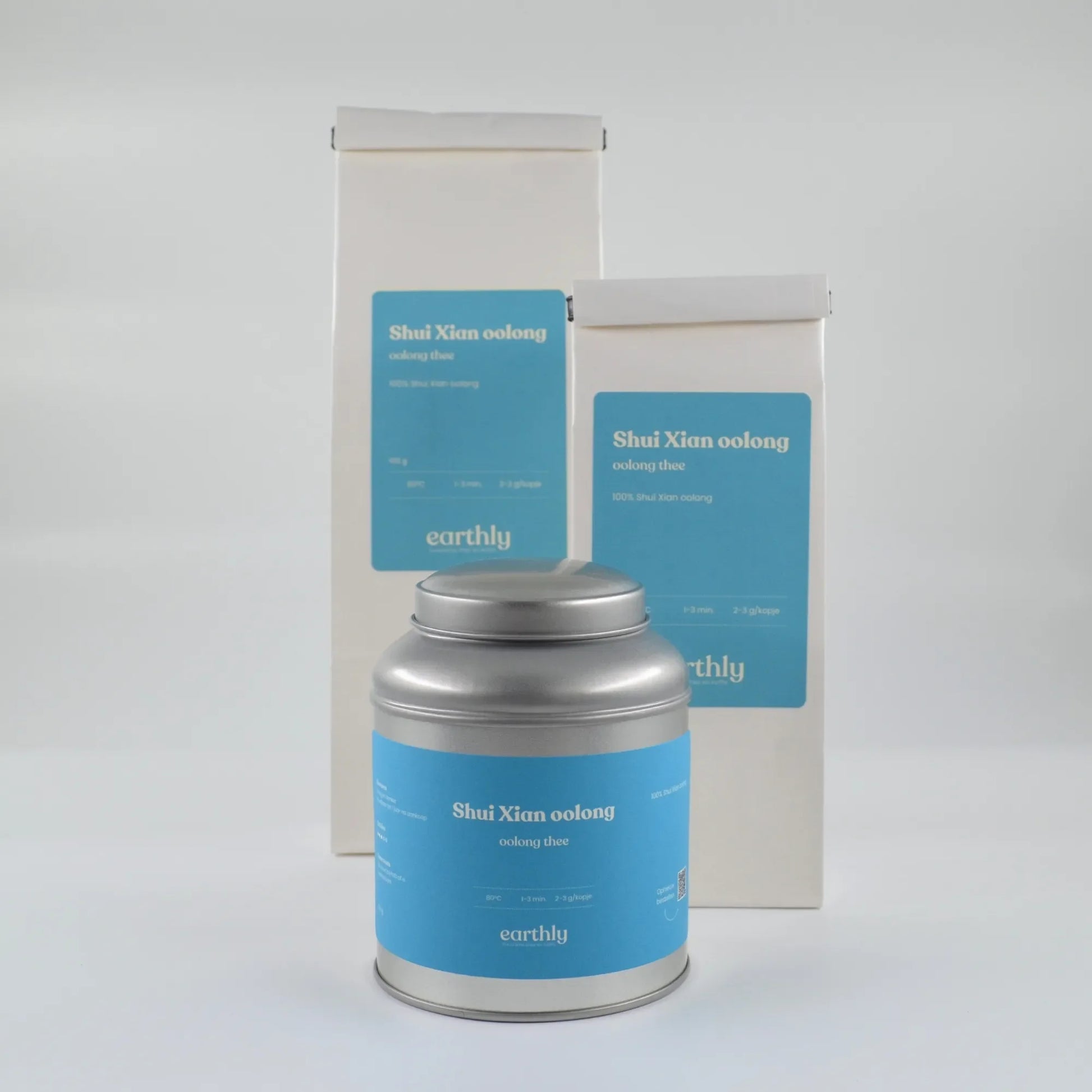 Verpakking van Shui Xian oolong thee van Earthly met metalen theeblik en witte kartonnen zakken