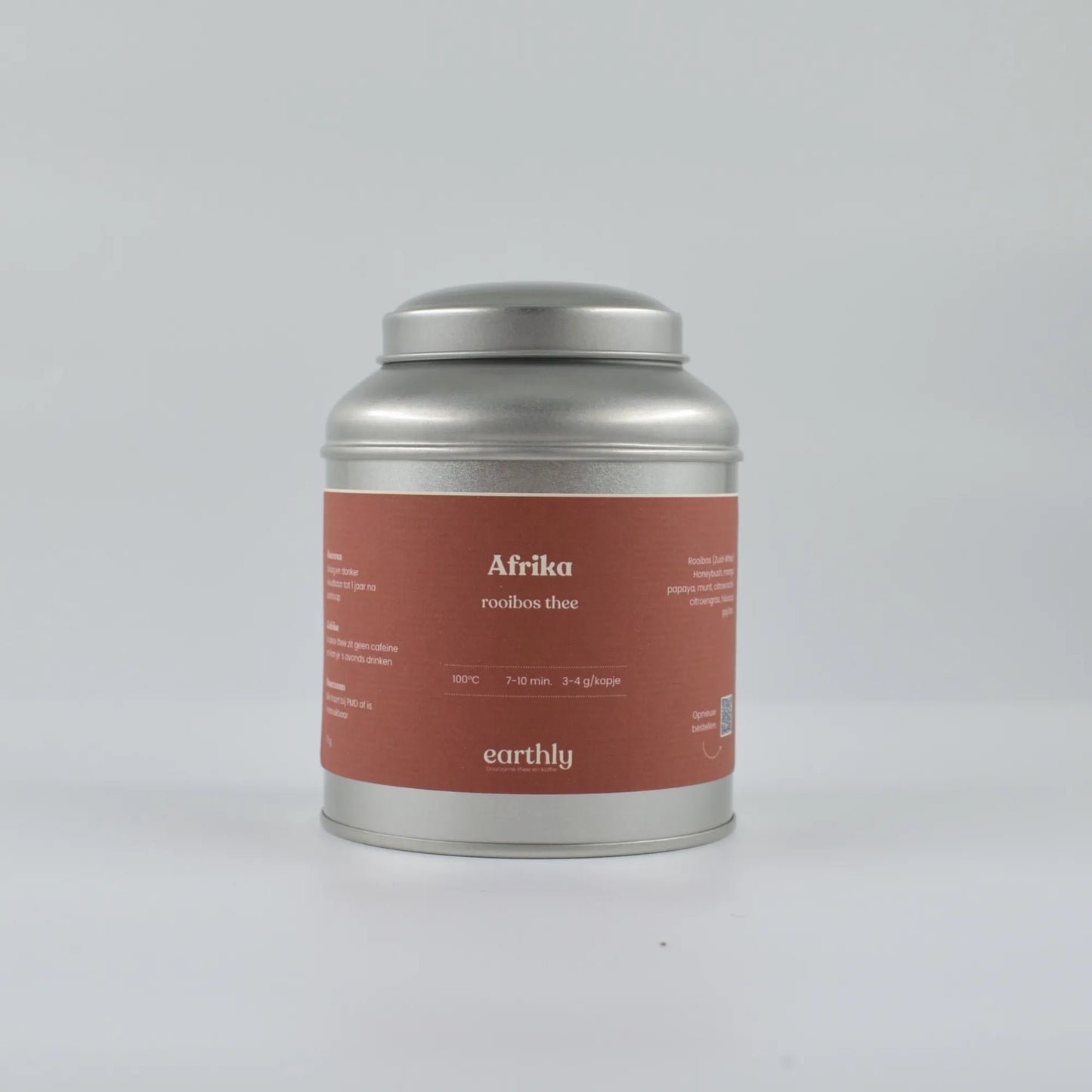 Zilverkleurig theeblik met rood etiket Afrikaanse rooibos thee branding