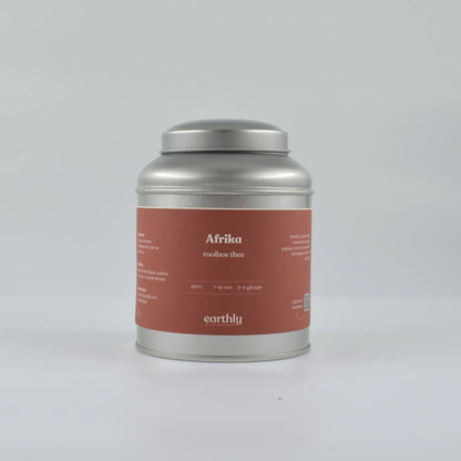 Zilverkleurig theeblik met rood etiket Afrikaanse rooibos thee branding