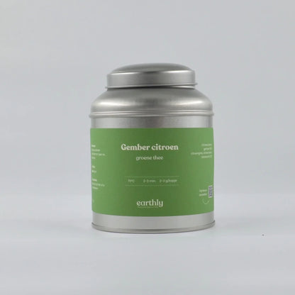 Zilverkleurig theeblik met groene label van gember citroen groene thee van Earthly