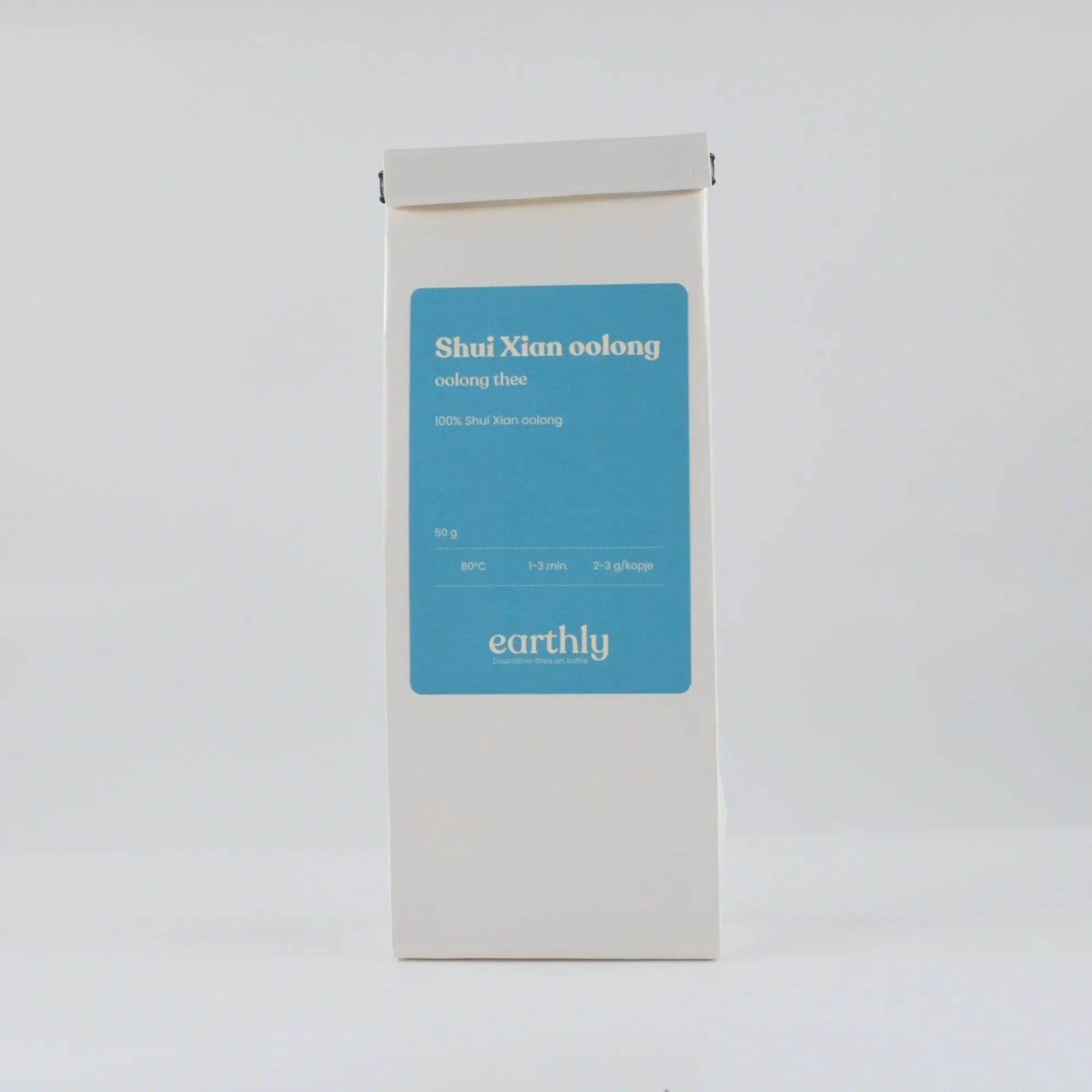 Witte verpakking Shui Xian oolong thee met blauw etiket van Earthly, duurzaam oolong thee