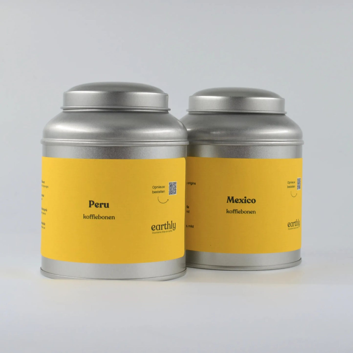Twee metalen blikken met gele labels, Peru en Mexico koffiebonen van Earthly