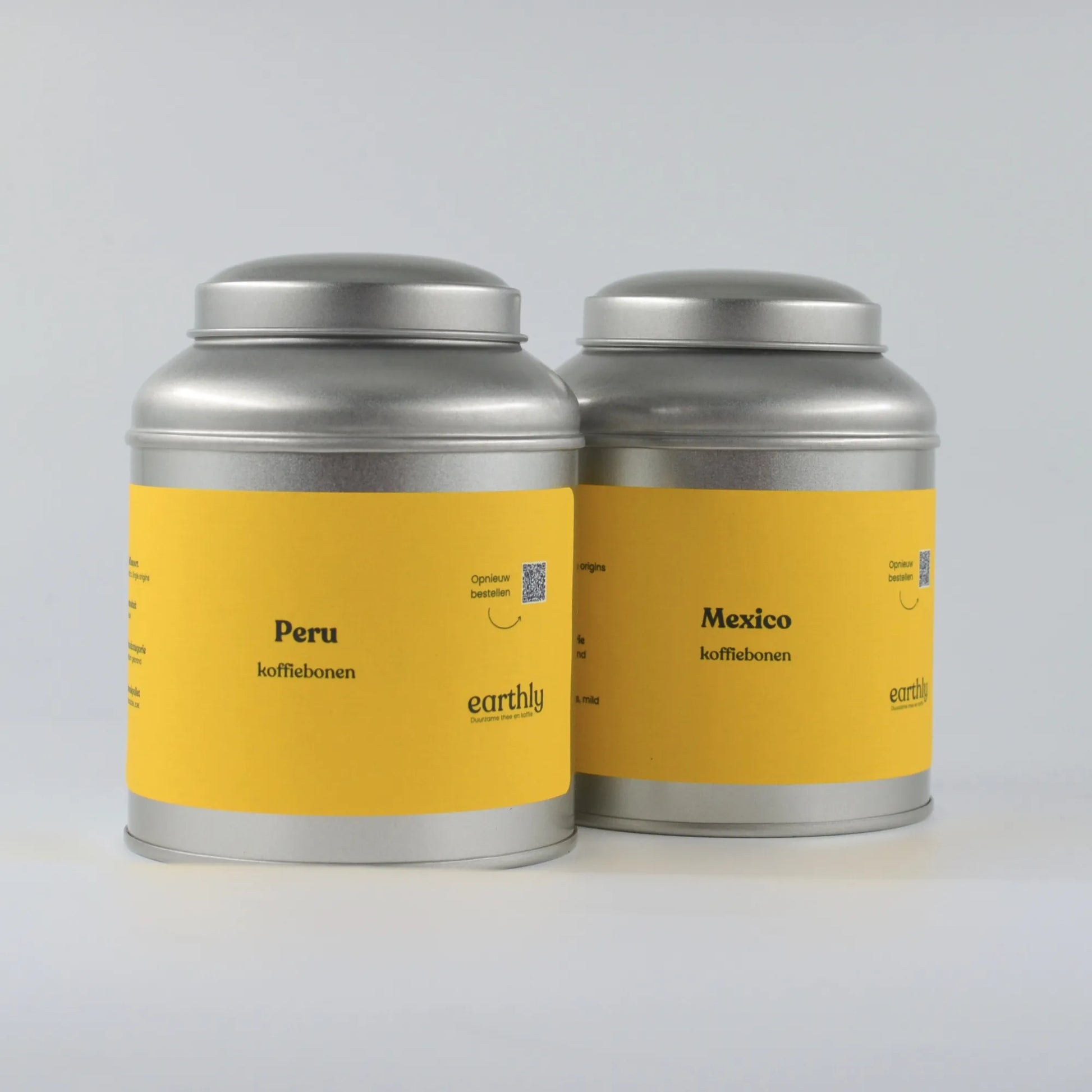 Twee metalen blikken met gele labels, Peru en Mexico koffiebonen van Earthly