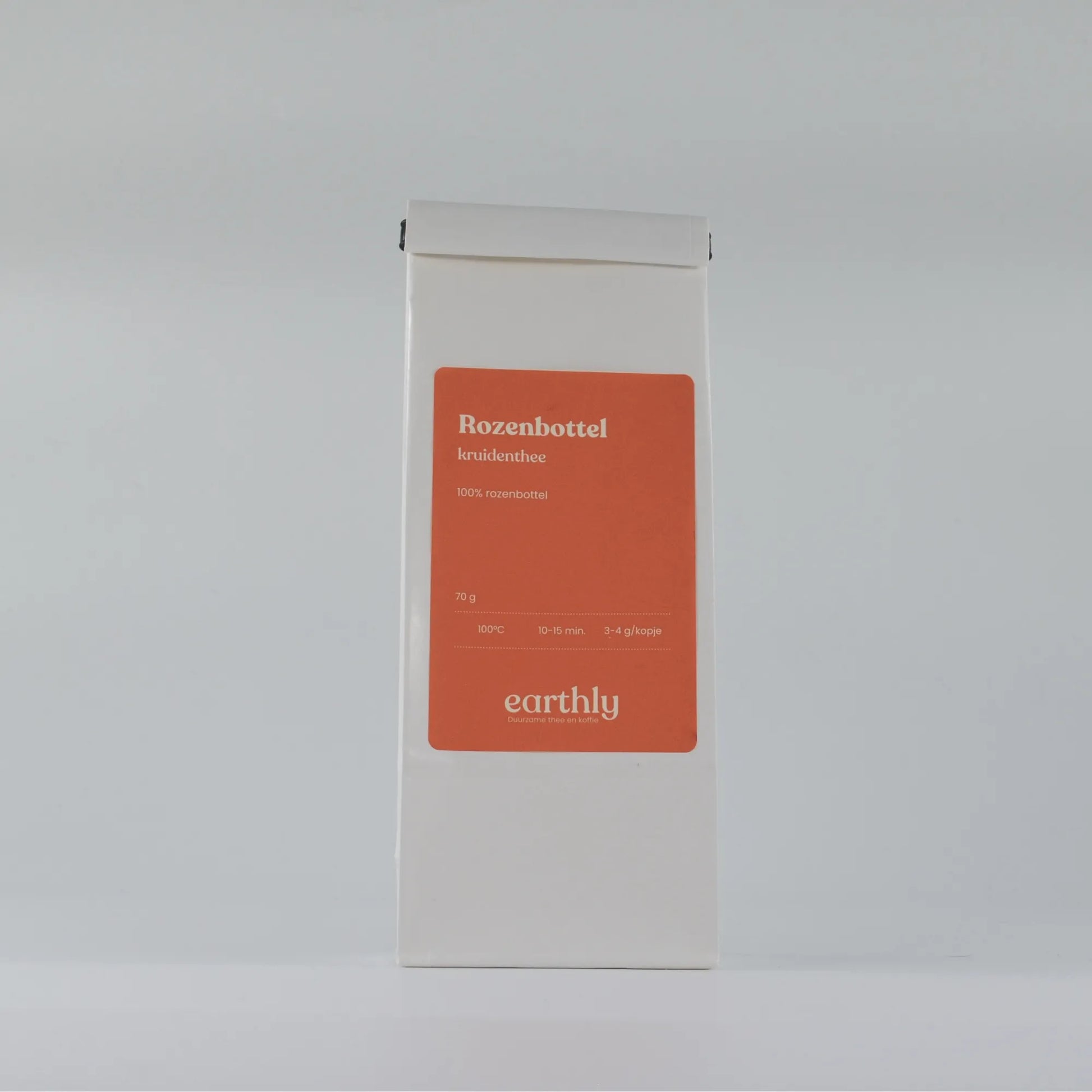 Witte verpakking rozenbottel kruidenthee 70g van Earthly met rood etiket